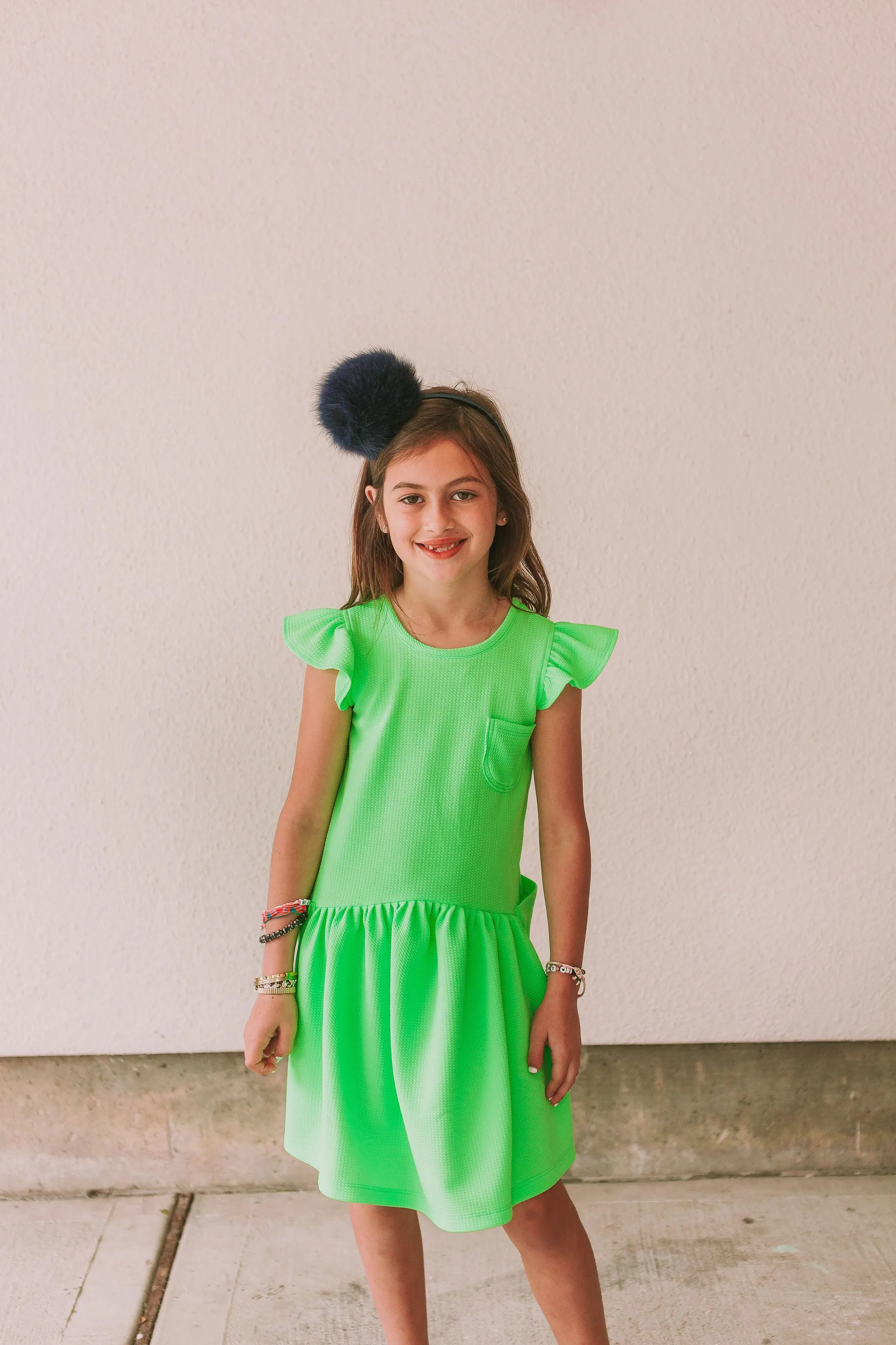 Little Girl's Neon Green Bullet Knit Cotton Three Pocket Dress