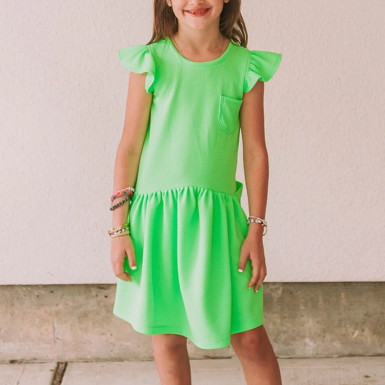 Little Girl's Neon Green Bullet Knit Cotton Three Pocket Dress